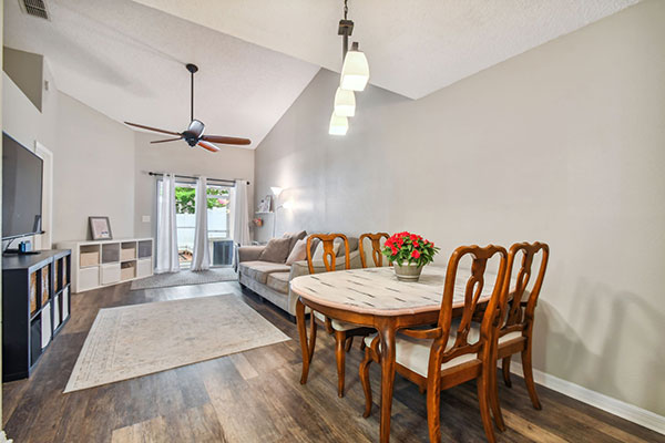 Dining-Room-Living-Room-Combo-leading-to-Screened-in-Patio-and-Private-Courtyard-1707